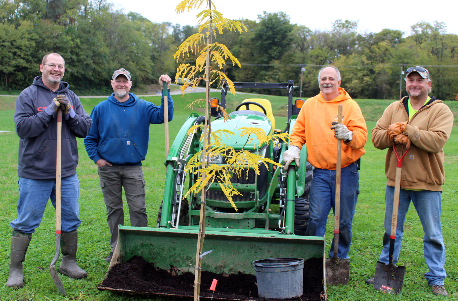 Pausing for a moment from planting trees at Hillsboro Central Park Saturday morning, Oct. 30, from the left are Mayor Don Downs, Superintendent of Parks, Lakes and Rec Jim May,  Bob Schwandner and Jeff Parks.