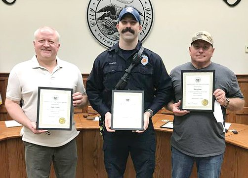 Four city employees were honored for their years of service to Litchfield on Thursday, Dec. 2, at the Litchfield City Council meeting. From the left are Police Sergeant Dan Evans (25 years), Firefighter Mat Boston (five years) and Firefighter Gary Law (25 years). Not pictured is Gerald Hull, who has worked 20 years for the Litchfield Street Department.